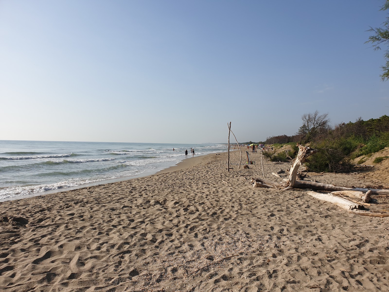 Foto von Spiaggia della Bassona mit heller sand Oberfläche