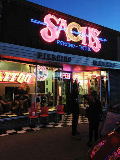 Find boyfriend name tattoo under breast ideas for your next unique tattoo in Albuquerque at Sachs Body Modification