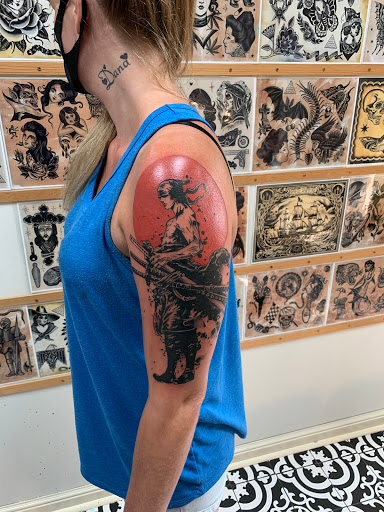 Explore skydive tattoo ideas, creative tattoo ideas in Milwaukee, available at MANIA Tattoos Milwaukee