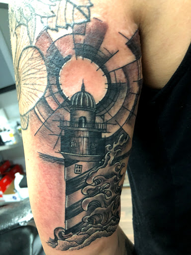 Find small joker tattoo ideas for your next unique tattoo in Wake Forest at Revelation Ink Tattoo and Piercing