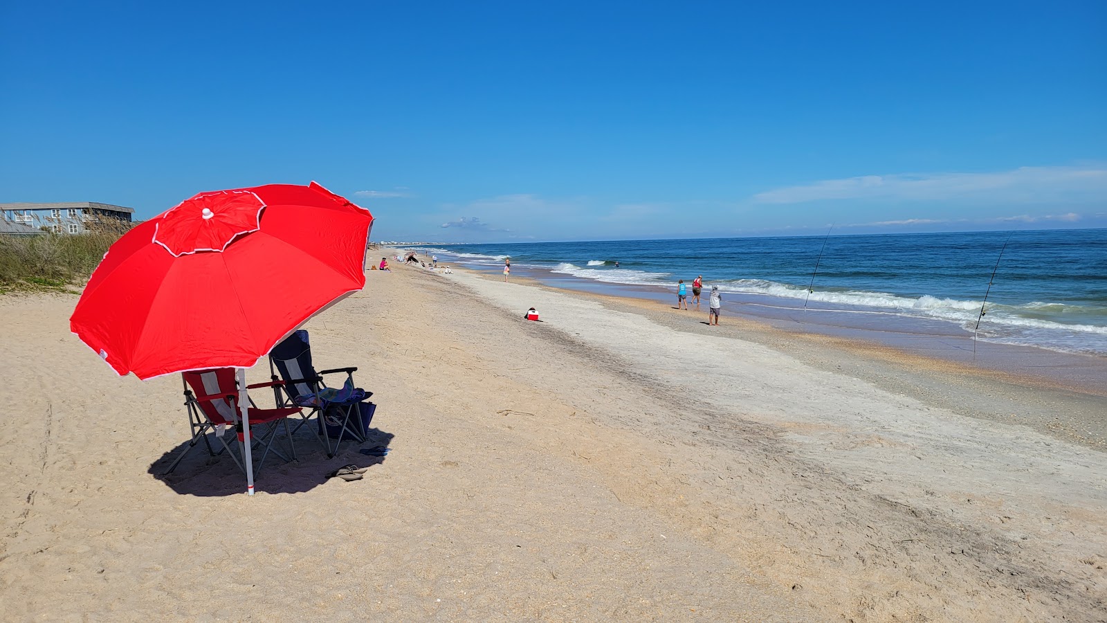 Foto av Surfside Park med beige skalsand yta