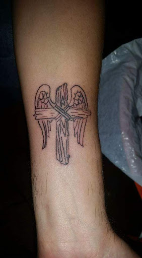 Explore spark plug tattoo ideas, creative tattoo ideas in Davis, available at SIX GUN SOUND TATTOO