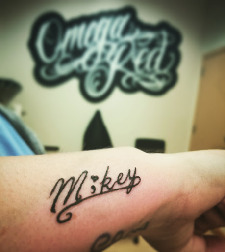 Explore patriotic forearm tattoo ideas, creative tattoo ideas in Cedar Falls, available at Omega Red Piercing & Tattoo