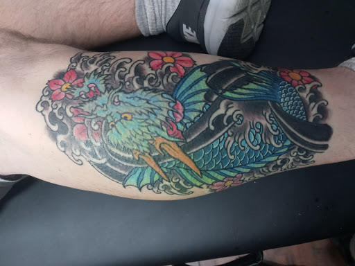 Explore five finger death punch tattoo ideas, creative tattoo ideas in Jacksonville, available at Cloak and dagger tattoo and fine arts gallery