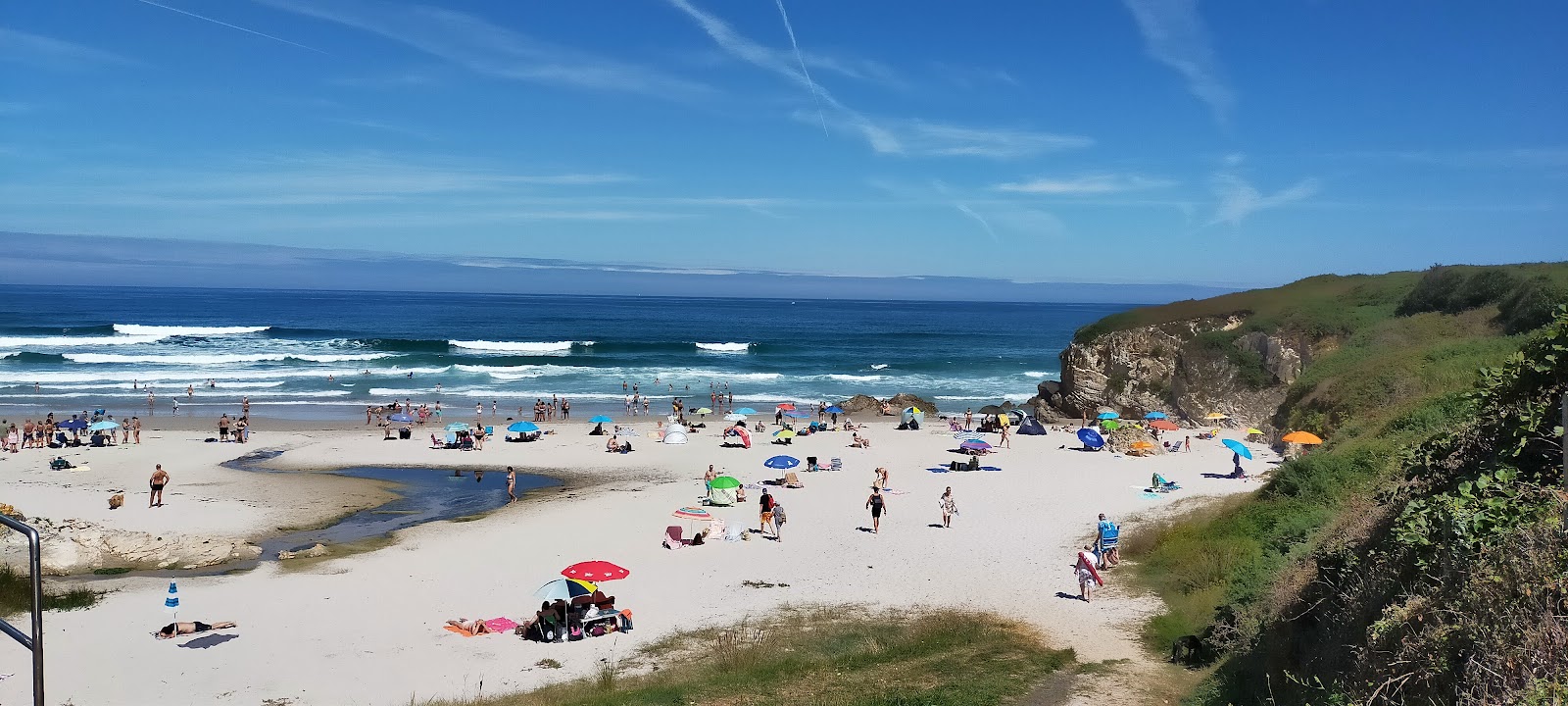 Foto di Praia de Longara con una superficie del sabbia beige