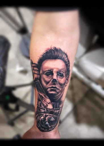 Explore dinosaur tattoo ideas for son, creative tattoo ideas in Peoria, available at Iron Key Tattoo Studio Inc.