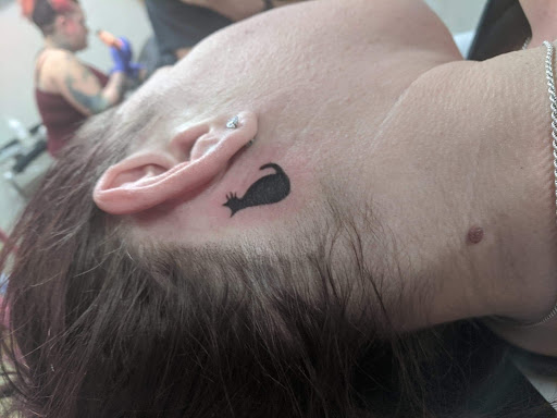Explore red ink neck tattoo ideas, creative tattoo ideas in Belgrade, available at The Loyal Sparrow Tattoo and Piercing