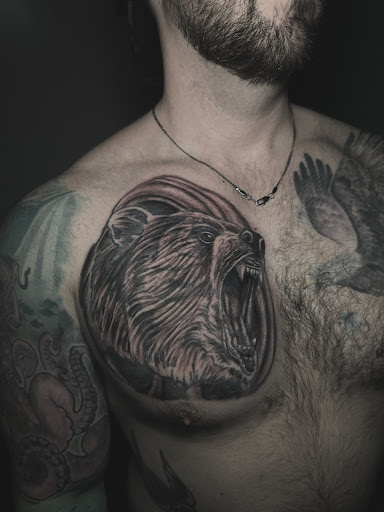 Explore tattoo cover up ideas for upper back, creative tattoo ideas in Toledo, available at Infinite Art Tattoo Studio