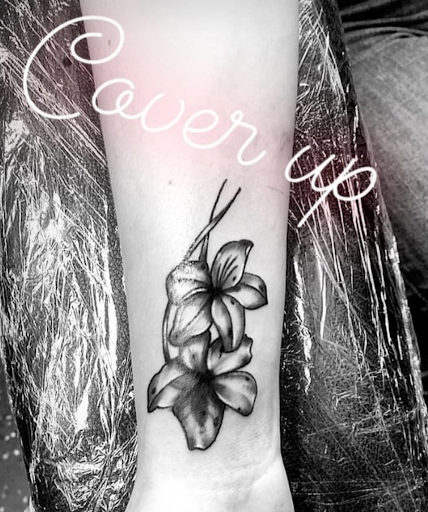 Explore neck word tattoo ideas, creative tattoo ideas in Vancouver, available at Studio X Tattoos & Piercings