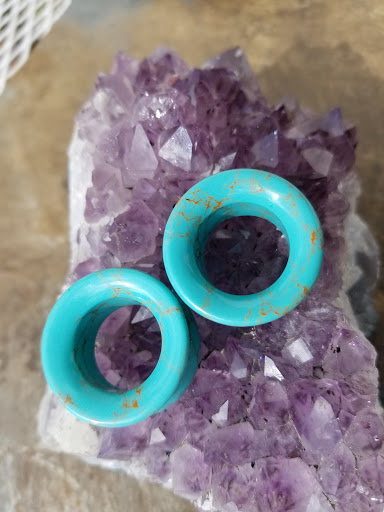 Find jewel tattoo ideas for your next unique tattoo in Powell at Against All Odds Tattoos and Piercings