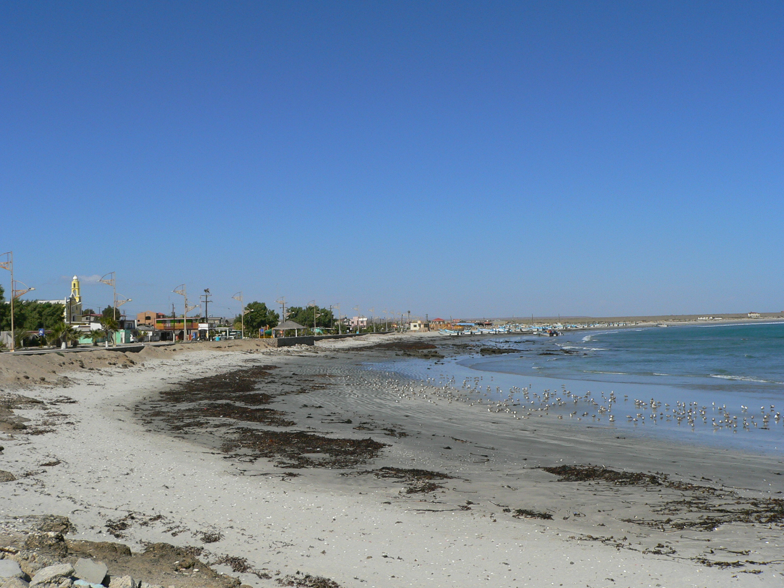 Photo of Punta Abreojos Beach with brown sand &  rocks surface