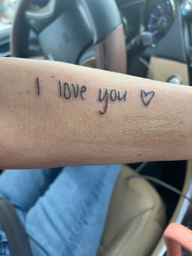 Explore name cover up tattoo ideas for men, creative tattoo ideas in Nashville, available at One Drop Ink Tattoo Parlour and Gallery