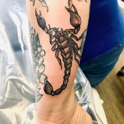 Explore female tattoo placement ideas, creative tattoo ideas in Lake City, available at Crooked Spines Tattoo Studio