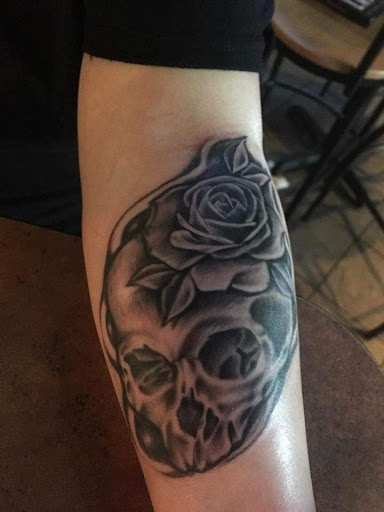 Explore upper back tattoo cover up ideas, creative tattoo ideas in Bullhead City, available at Smoke and Dagger Tattoo