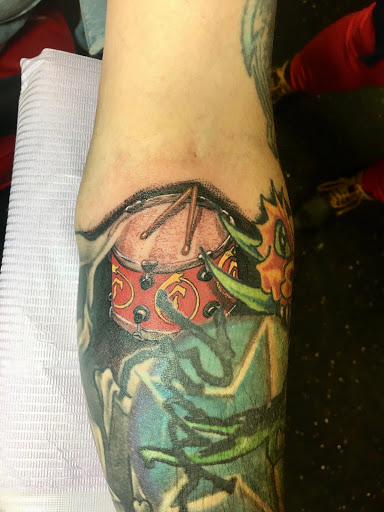 Explore men's forearm tattoo ideas, creative tattoo ideas in Louisburg, available at Lewter Tattoos and Piercing