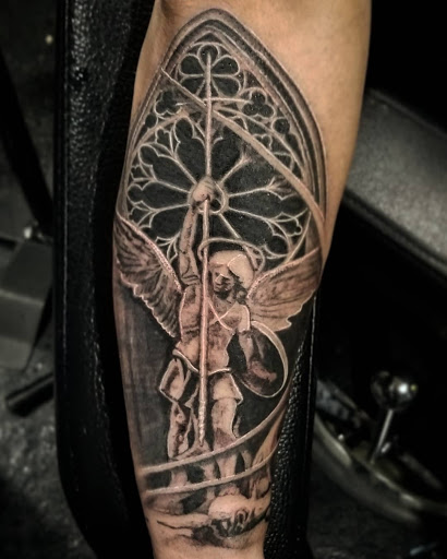 Find dino tattoo ideas for your next unique tattoo in Kenosha at Kenosha Tattoo Company
