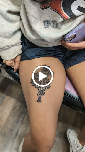 Explore front of neck tattoo ideas, creative tattoo ideas in Cornelia, available at Prismatic Pulse Tattoo