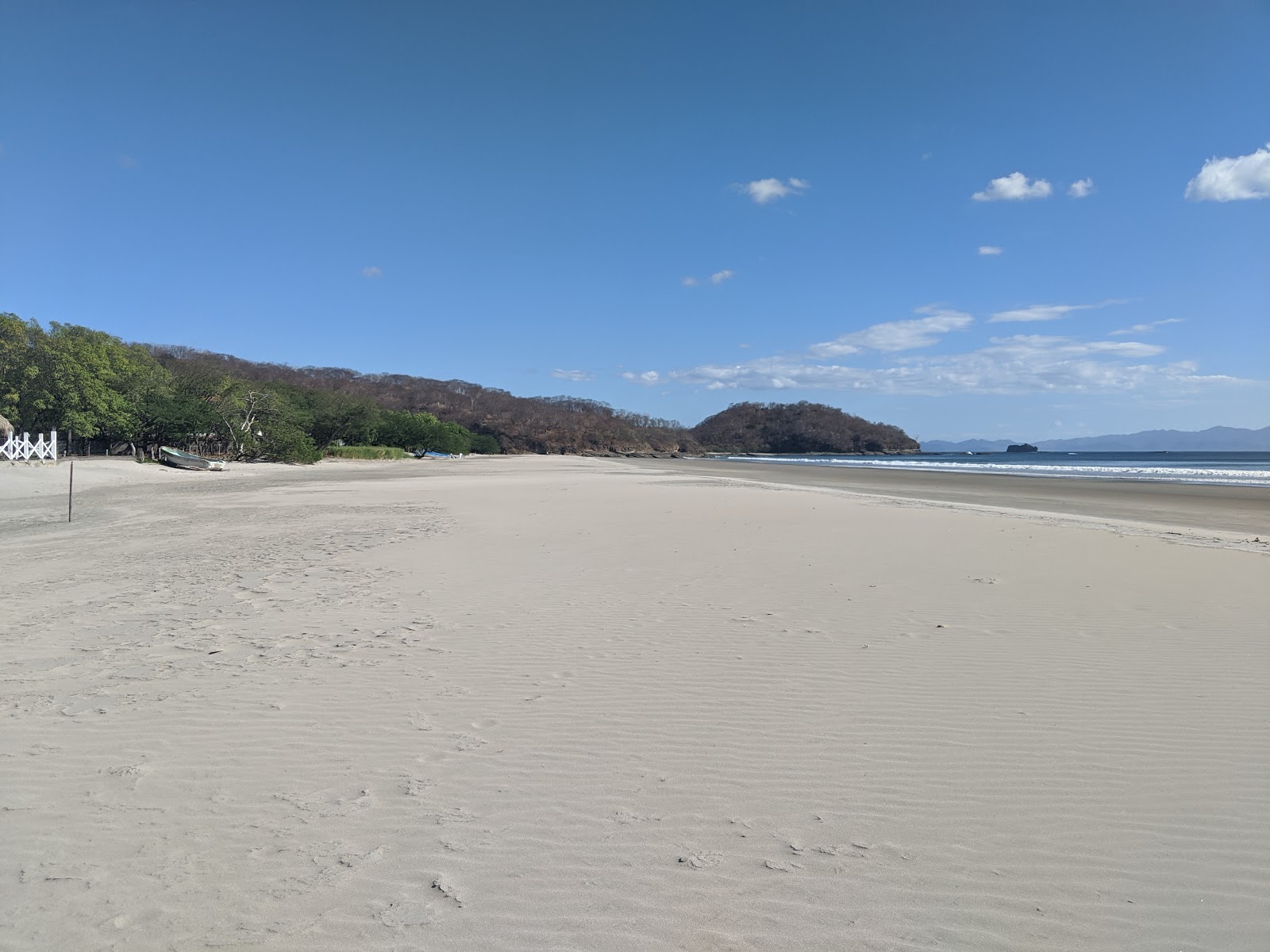 Foto von Der Coco Beach mit langer gerader strand