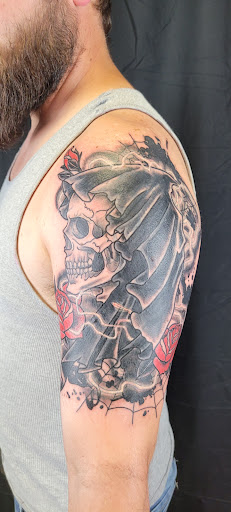 Explore barbed wire tattoo cover up ideas, creative tattoo ideas in Anniston, available at Lucid Dreams Tattoos and Piercings