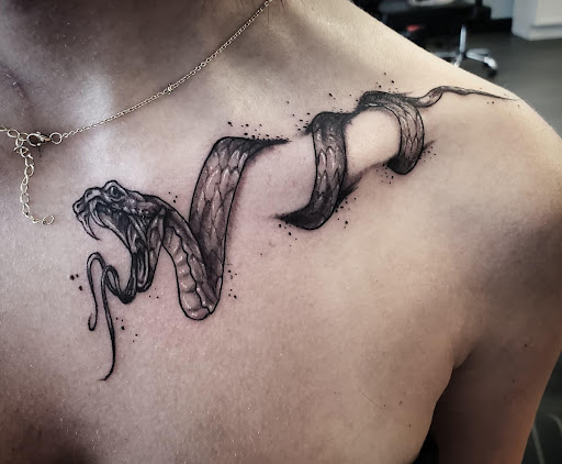 Explore barbed wire tattoo cover up ideas, creative tattoo ideas in Palm Harbor, available at Angry Owl Tattoo and Piercing