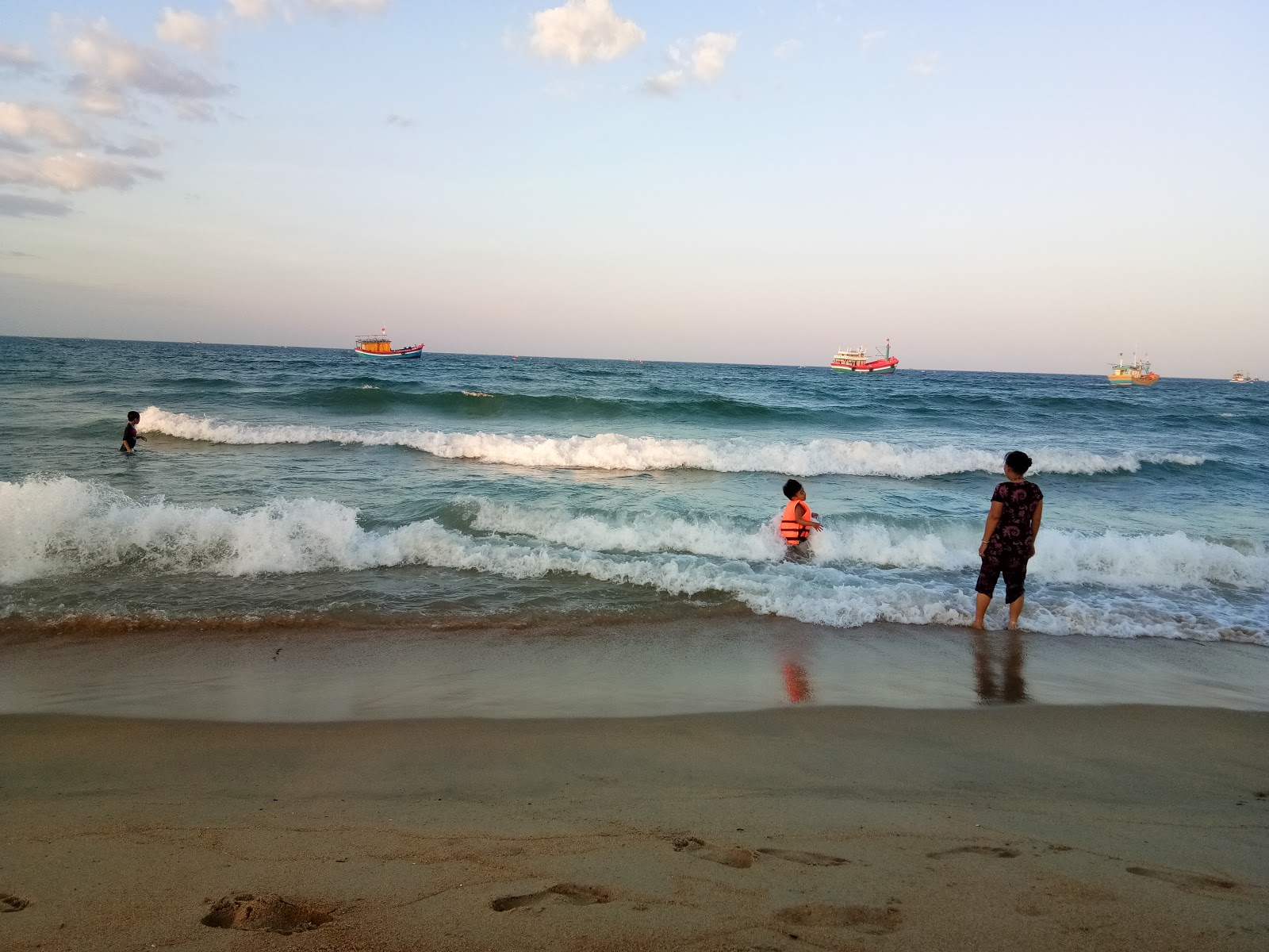 Fotografija My Thang Beach z svetel pesek površino