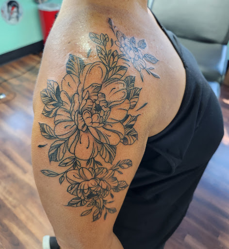 Explore knee scar tattoo ideas, creative tattoo ideas in Reno, available at Evolution Tattoo