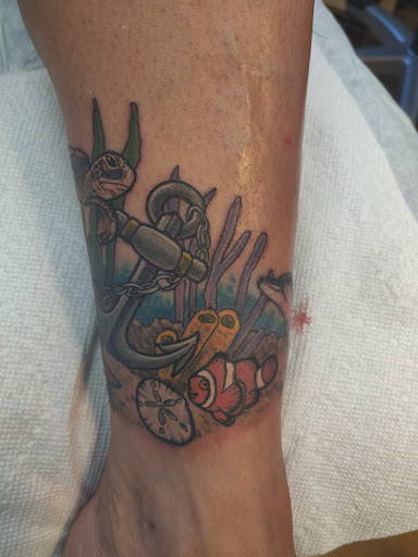 Explore honeysuckle tattoo ideas, creative tattoo ideas in Lockport, available at Tattoo City by Larry Brogan