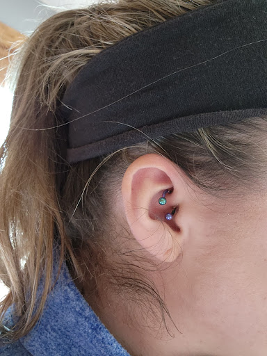 Explore tattoo cover up ideas on forearm, creative tattoo ideas in Toledo, available at Artistik Tat2 and Body Piercing