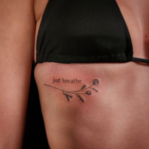 Explore tattoo ideas on ribs for men, creative tattoo ideas in Minocqua, available at Whisky Rose Tattoo Parlor