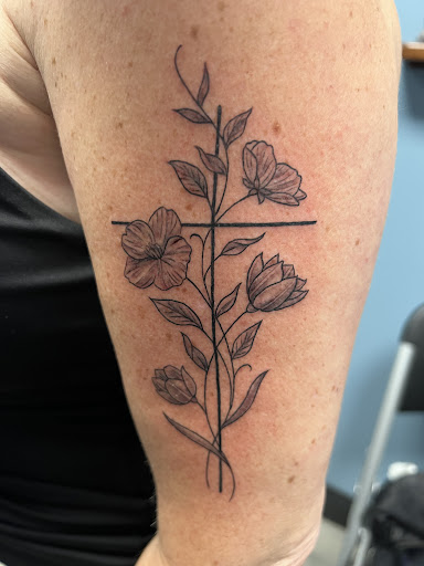 Find dino tattoo ideas for your next unique tattoo in Lake Hopatcong at Etched in Ink Tattoo