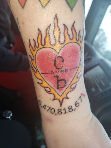 Explore ouroboros tattoo ideas, creative tattoo ideas in New Bern, available at Firehouse Tattoo.
