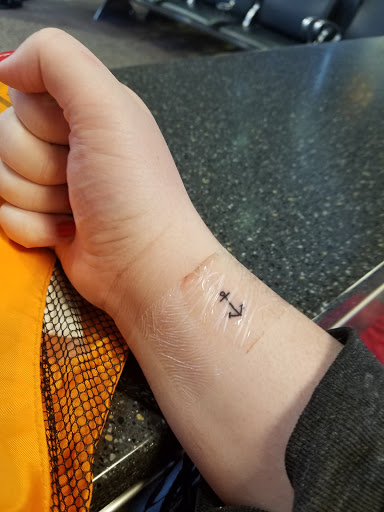 Explore family birth flower tattoo ideas, creative tattoo ideas in Salt Lake City, available at AWS TATTOOS PIERCING