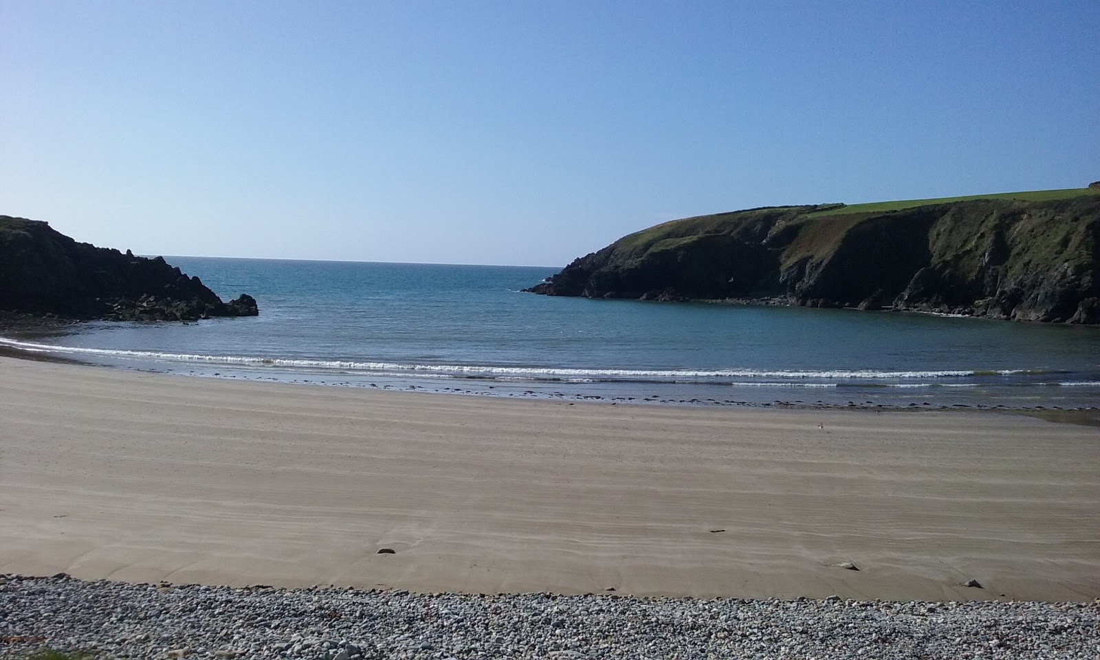 Photo of Kilmurrin Beach surrounded by mountains