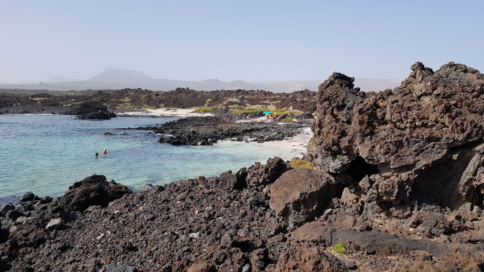 Foto av La Caleta med små multi -vikar