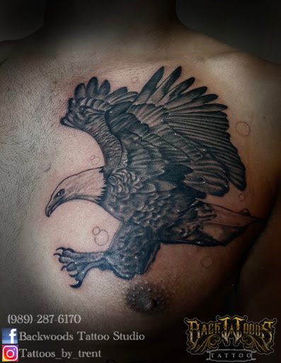 Explore side boob tattoo ideas, creative tattoo ideas in Lakeview, available at Backwoods Tattoo Studio