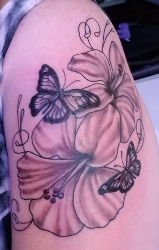 Explore tattoo ideas for men bicep, creative tattoo ideas in College Station, available at Big Daddys Tattoo Studio Renu Laser Removal