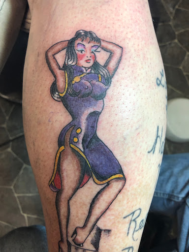 Explore spartan helmet tattoo ideas, creative tattoo ideas in Calumet, available at Tattooing by Big Ben
