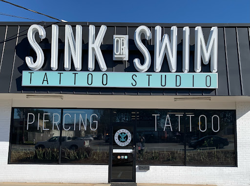 Explore logging tattoo ideas, creative tattoo ideas in Marietta, available at Sink or Swim Studio and Gallery
