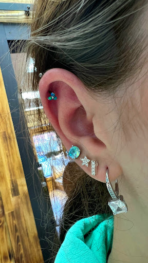 Explore rock music tattoo ideas, creative tattoo ideas in Sioux City, available at Thorn-Side Tattoo & Piercing