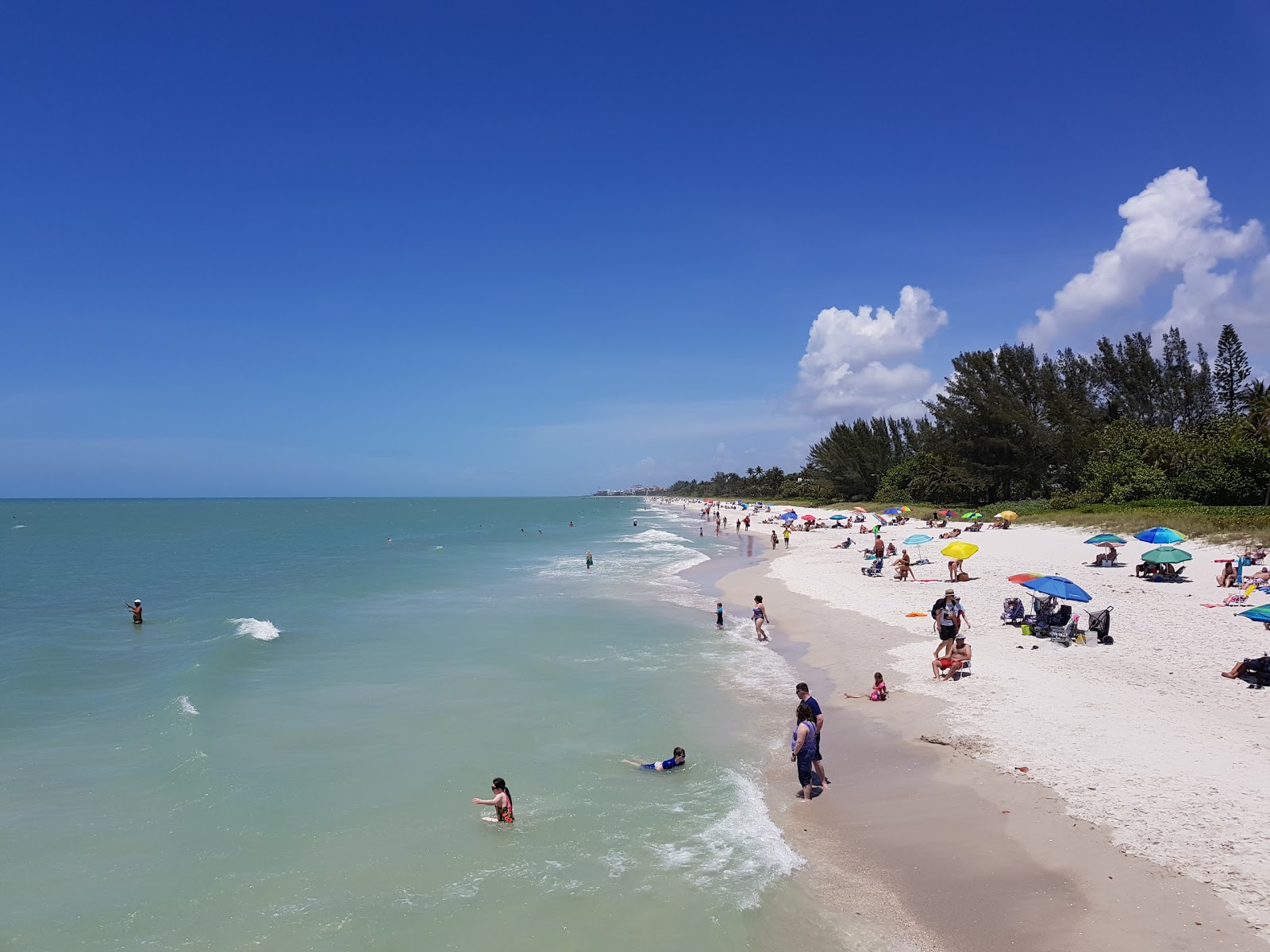 Photo of Naples beach with white sand surface