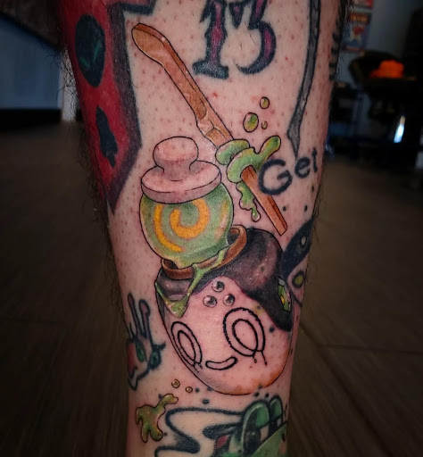 Explore small metal tattoo ideas, creative tattoo ideas in Palm Harbor, available at Angry Owl Tattoo and Piercing