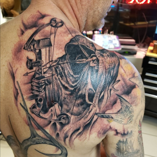 Explore men's inner bicep tattoo ideas, creative tattoo ideas in Mastic, available at Infinity Tattoo