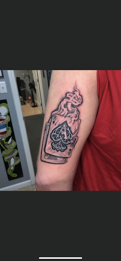 Find skull ideas sleeve tattoos for your next unique tattoo in Osage Beach at Lake Ozark Tattoo and Hair Studio