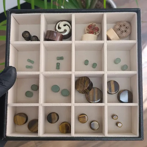 Explore open book tattoo ideas, creative tattoo ideas in Nacogdoches, available at Primal Piercing & Jewelry