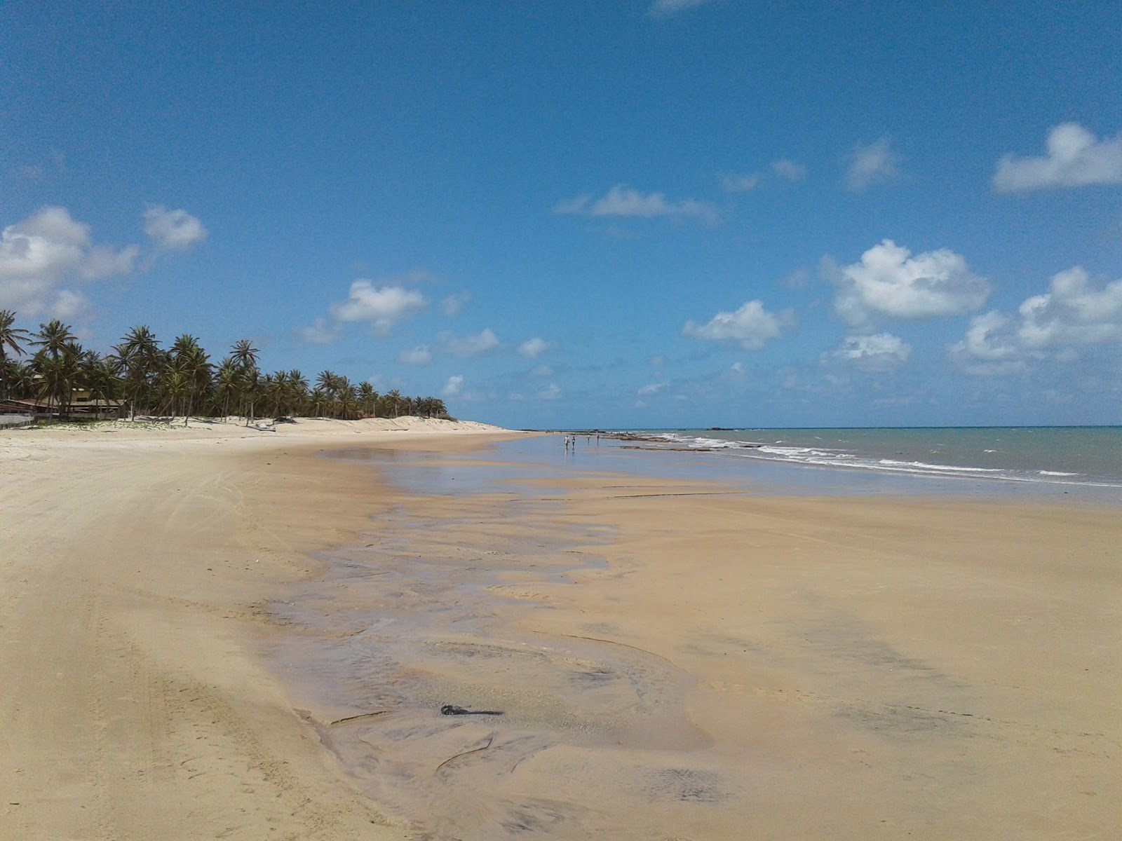 Foto de Praia de Perobas com areia fina e brilhante superfície