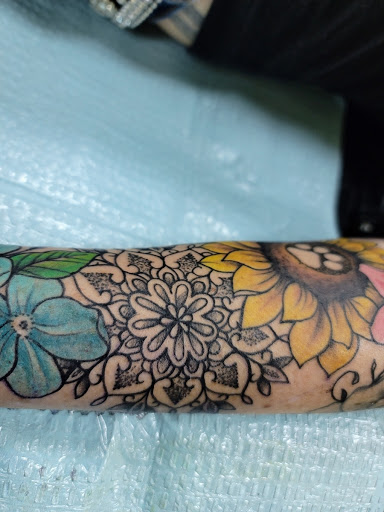 Explore new father tattoo ideas, creative tattoo ideas in Ocala, available at Lone Wolf Tattoo