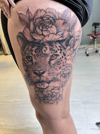 Explore guns and roses tattoo ideas, creative tattoo ideas in Salt Lake City, available at AWS TATTOOS PIERCING