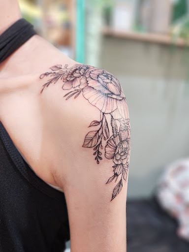 Explore mickey tattoo ideas, creative tattoo ideas in Charlotte, available at Olive Branch Tattoo Studio