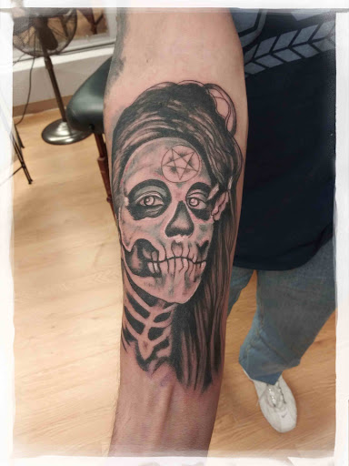 Find flower thigh tattoo ideas for your next unique tattoo in La Crosse at La Crosse Tattoo