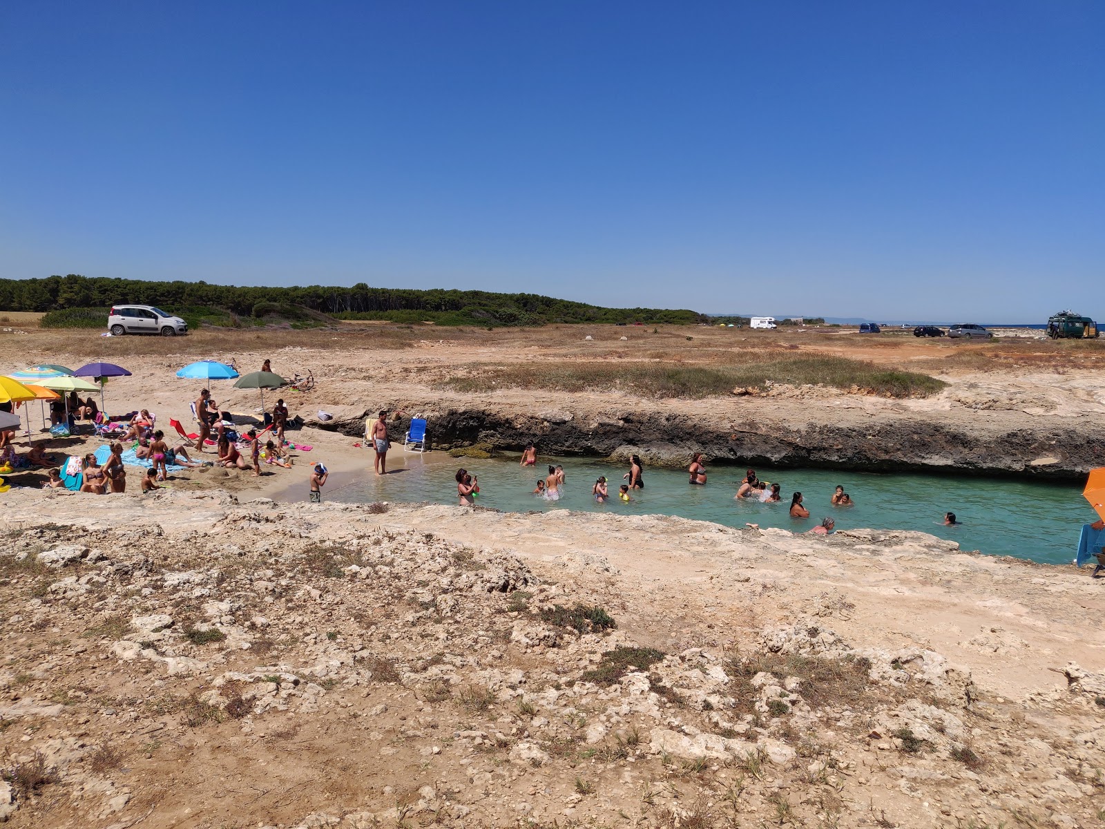Fotografie cu Costa Merlata beach cu o suprafață de apă pură albastră